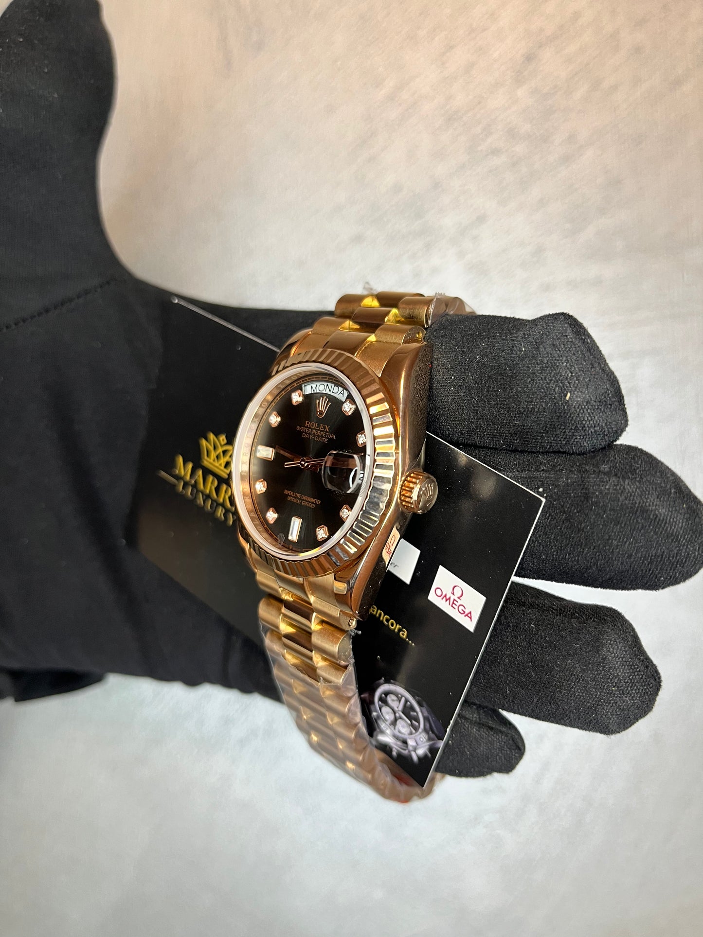 ROLEX DAYDATE PRESIDENT ORO ROSA QUADRANTE NERO CON BRILLANTINI
