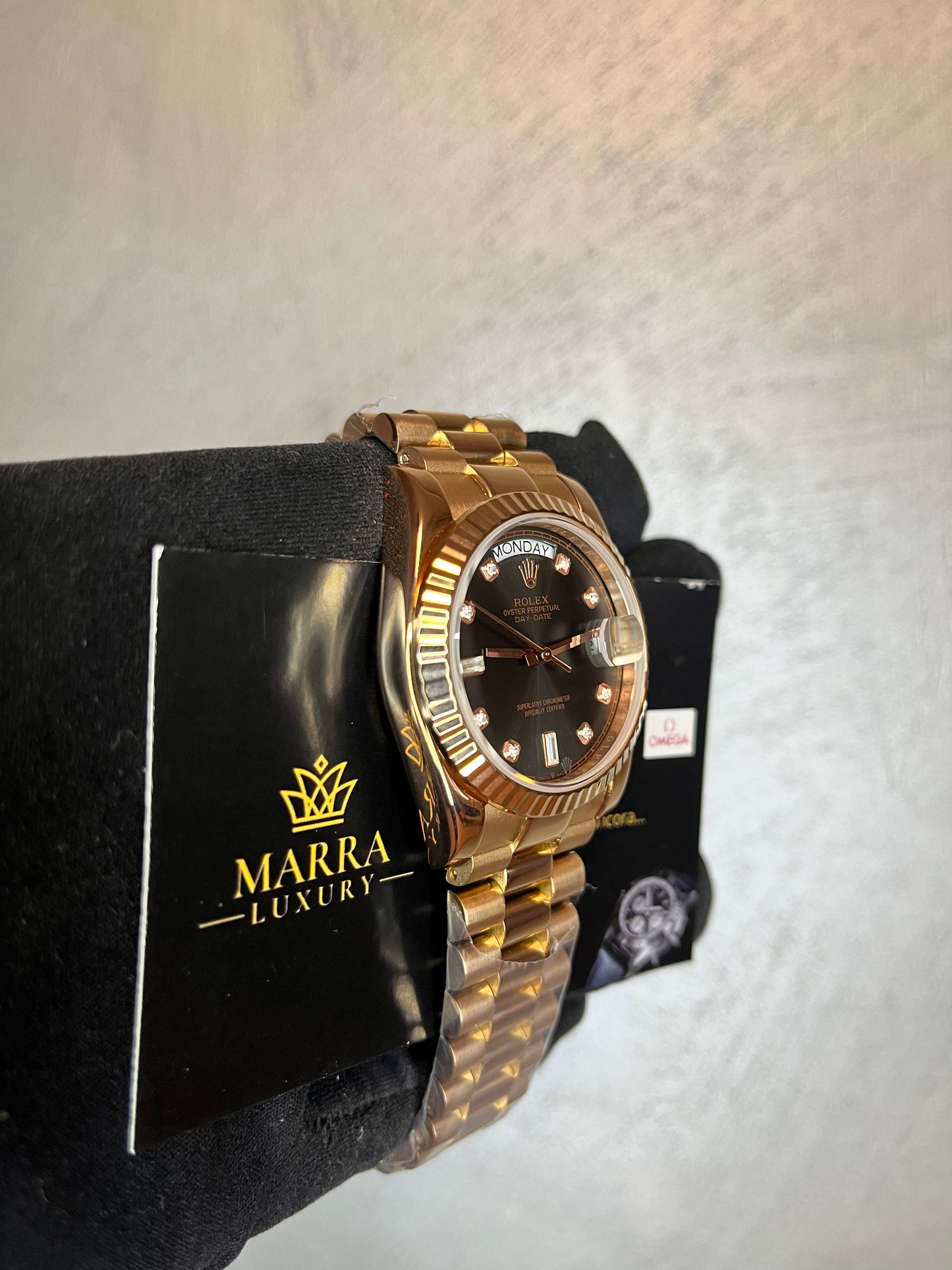 ROLEX DAYDATE PRESIDENT ORO ROSA QUADRANTE NERO CON BRILLANTINI