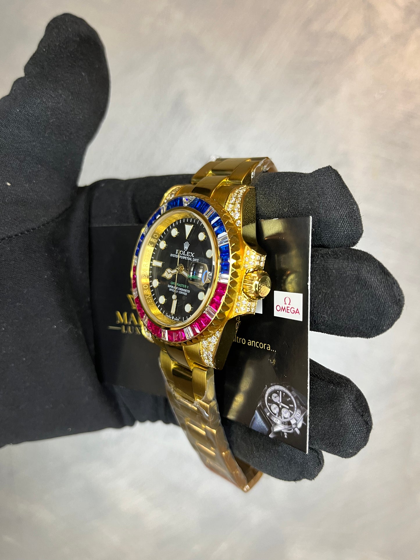 ROLEX GMT MASTER ORO GIALLO GHIERA CON BRILLANTINI BLU E ROSSI